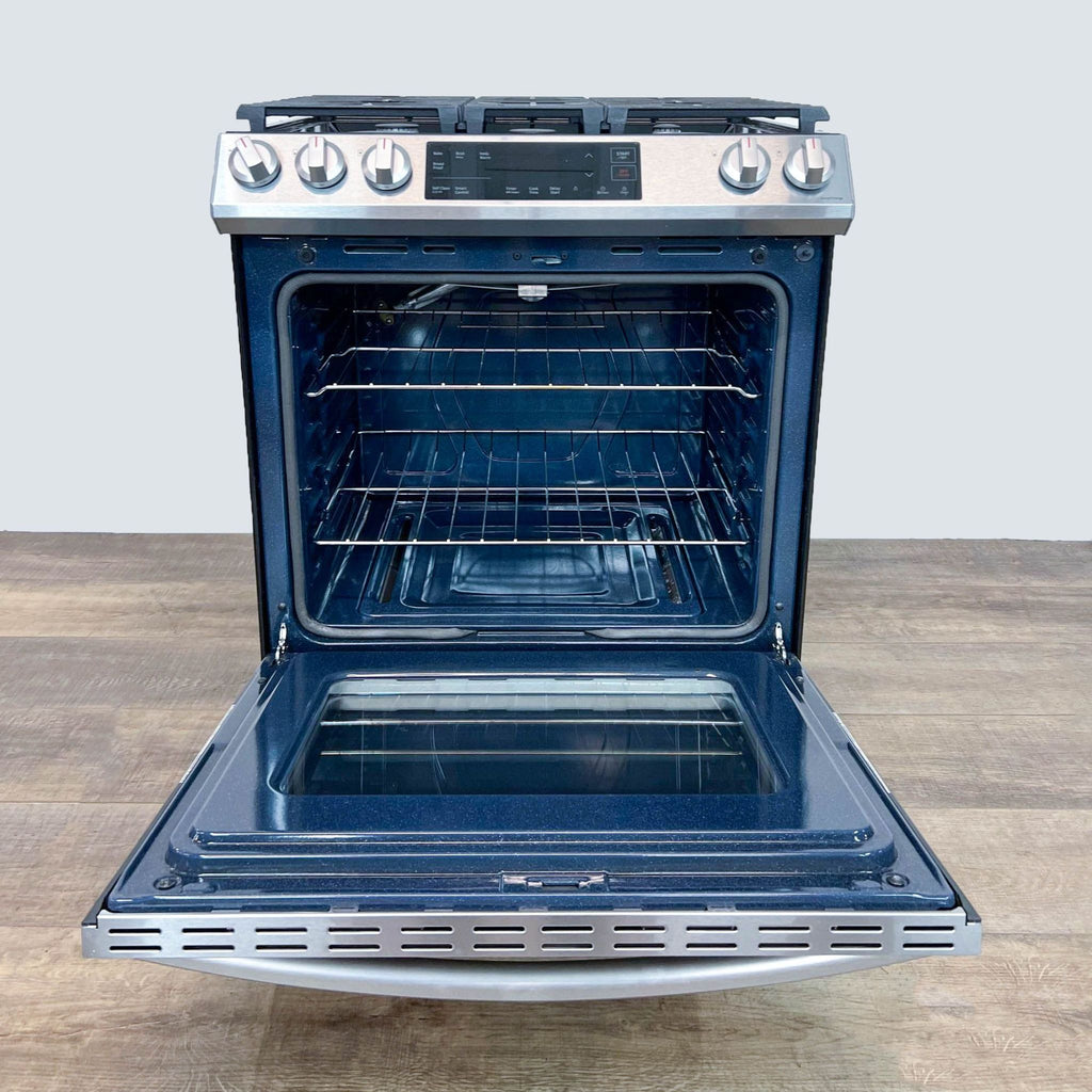Samsung oven with open door, showing spacious interior and metal racks.