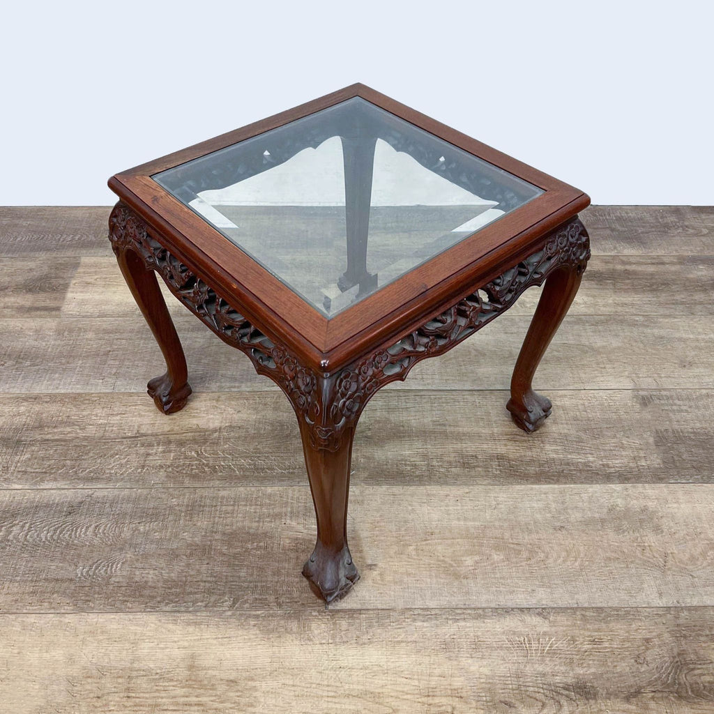 Square Chinese Chippendale style end table with decorative legs and glass surface.