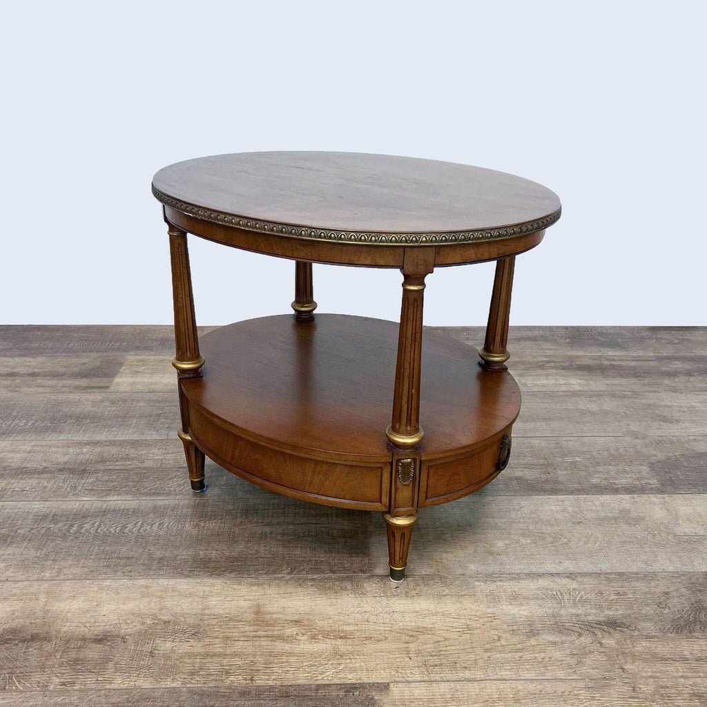 Elegant Henredon end table with ornate design and fluted legs.
