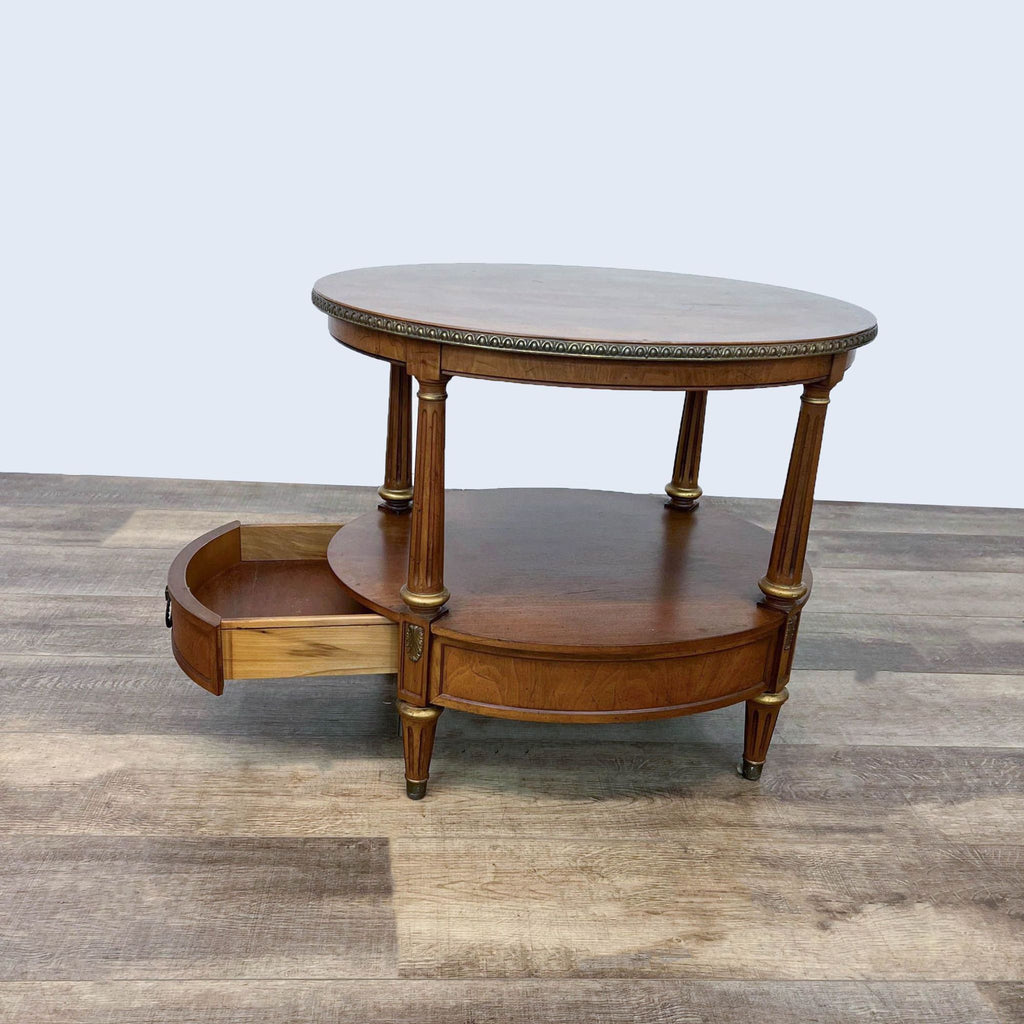 Round wooden end table by Henredon, featuring an open drawer.