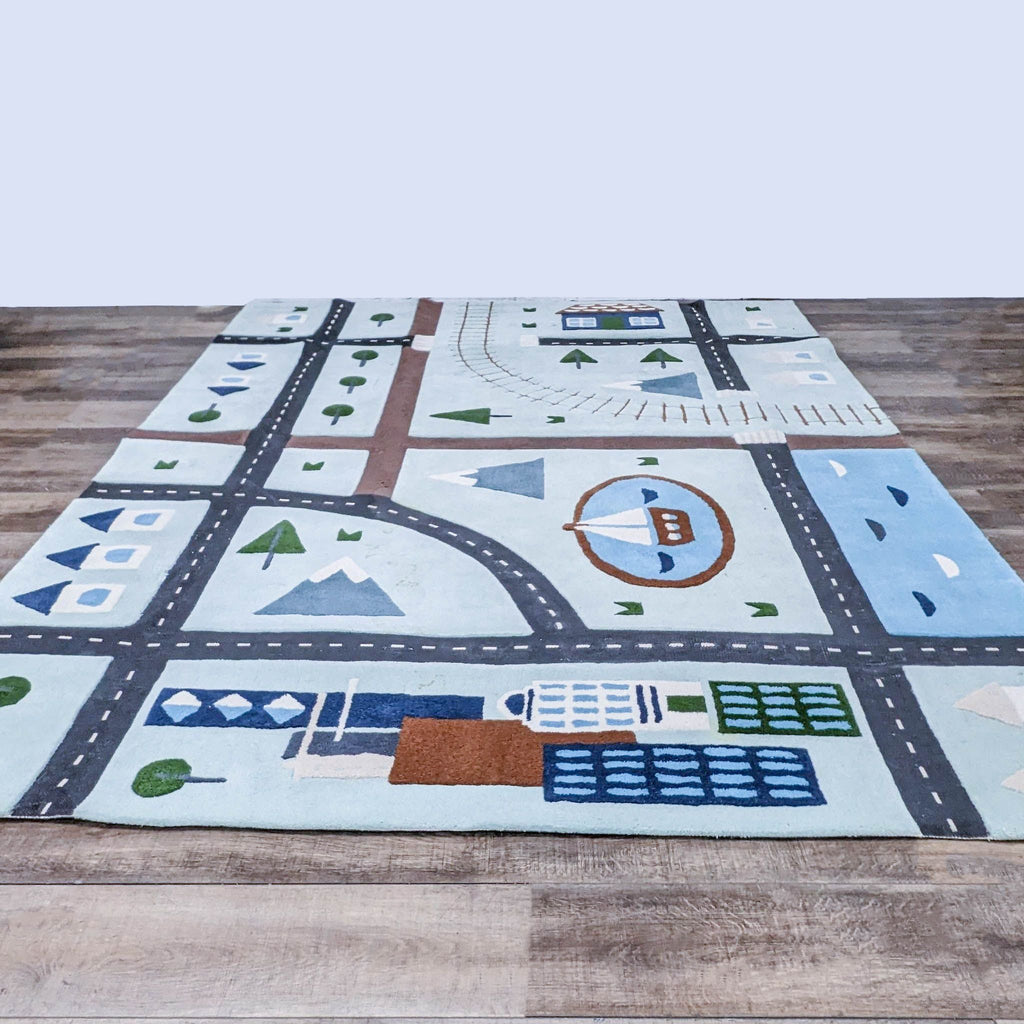 Crate & Barrel's City Car Kids Area Rug with roads, trees, and buildings for play.