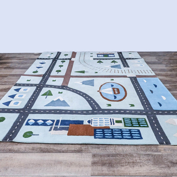 Crate & Barrel's City Car Kids Area Rug with roads, trees, and buildings for play.