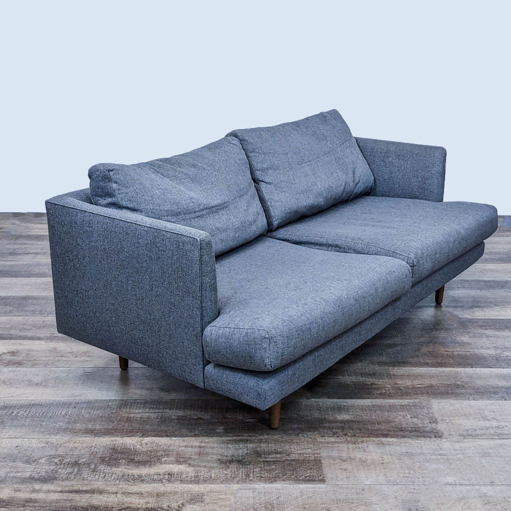 Graphite gray Article loveseat featuring deep seating and solid wood legs.