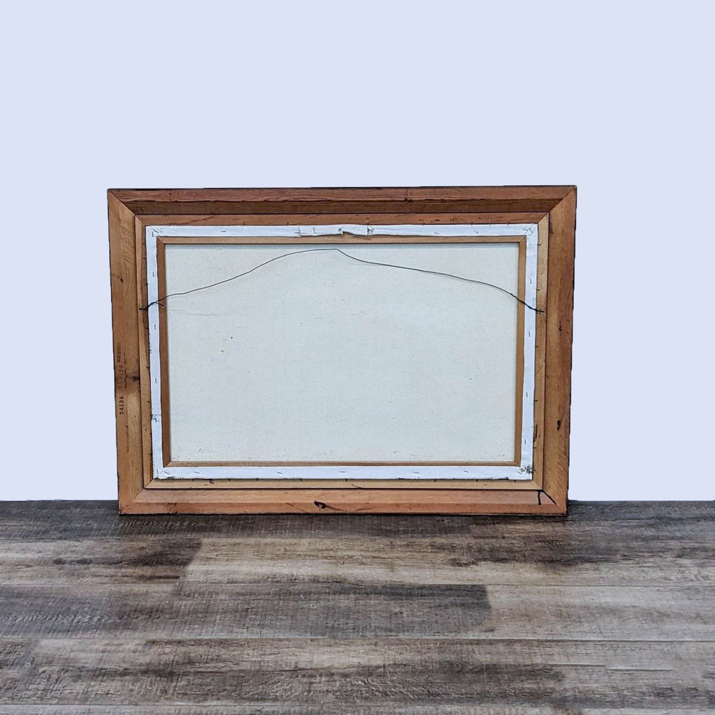 Back view of framed canvas painting with wooden frame.