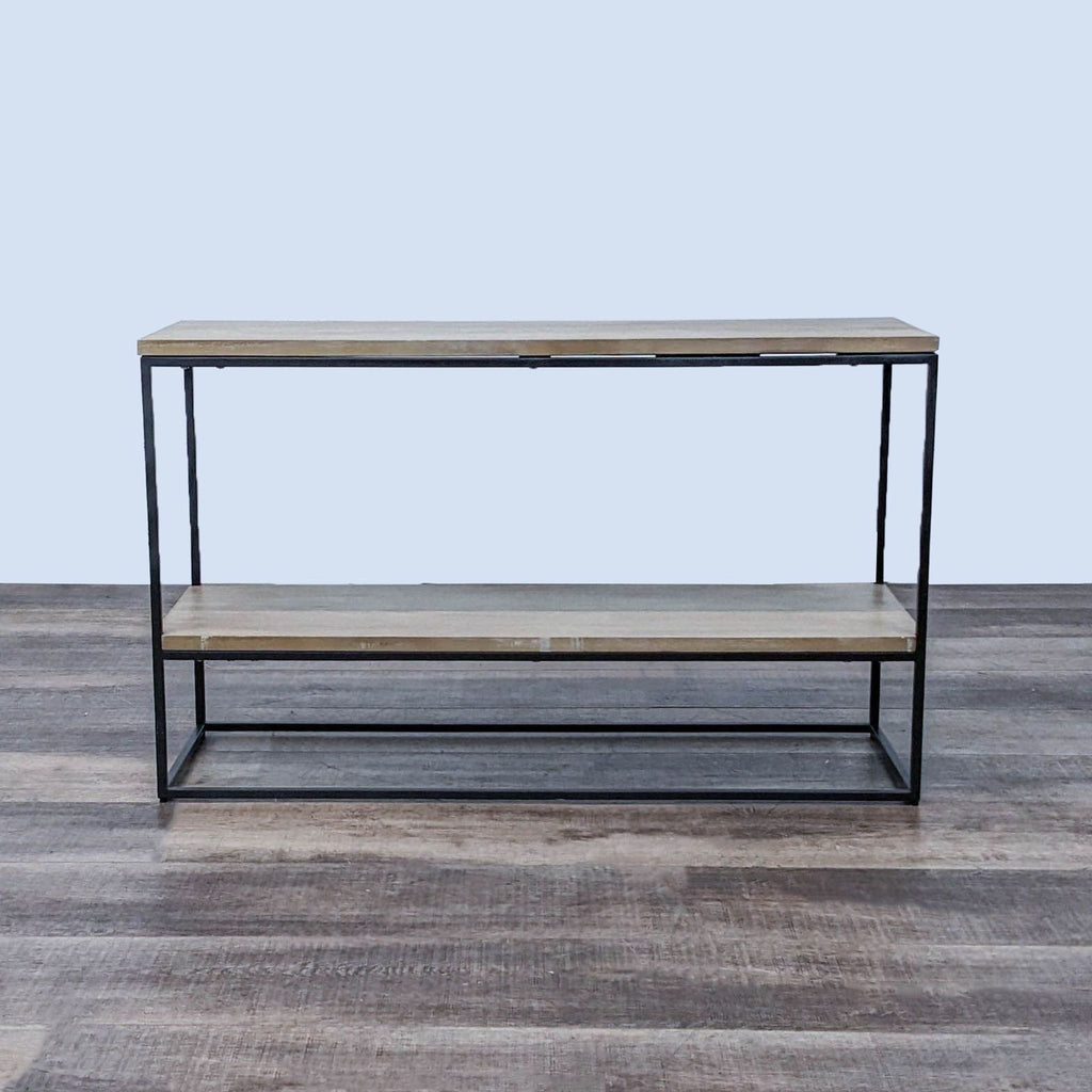 Front view of sleek West Elm bookshelf with metal frame.