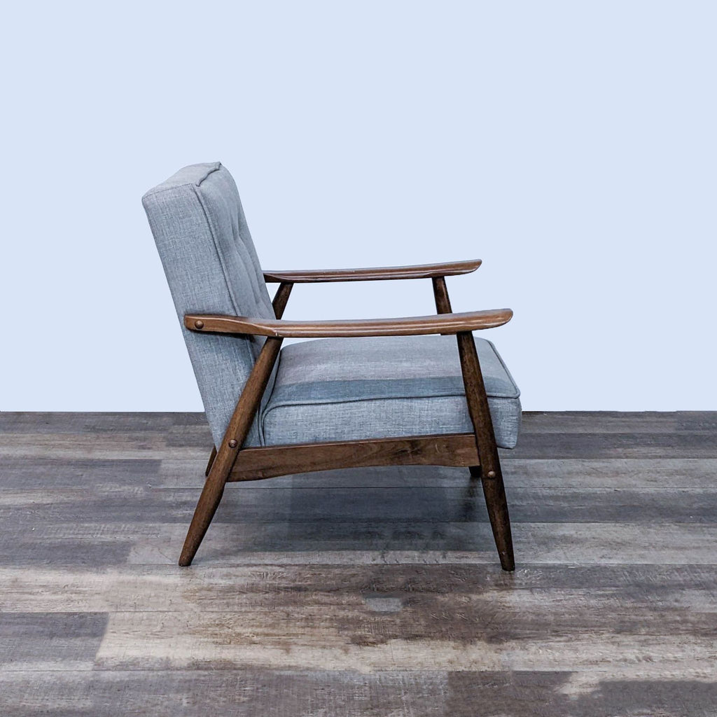 Side view of Rocky Armchair, showing sculpted angled arms and walnut-finished legs by Zuo Modern.
