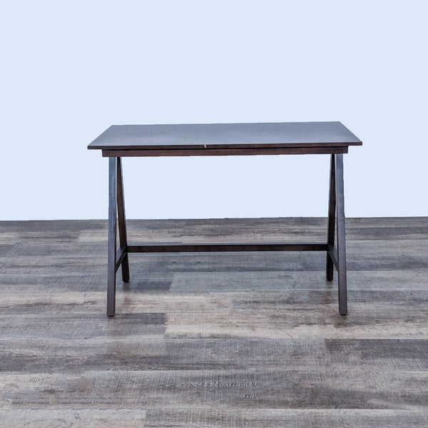 Front view of a Slant Front Leg Desk from Reperch, showcasing its wooden frame.