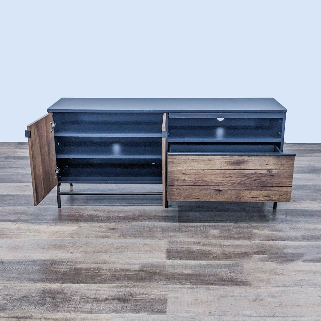 Open view of Sauder entertainment center showing spacious shelves and drawer.