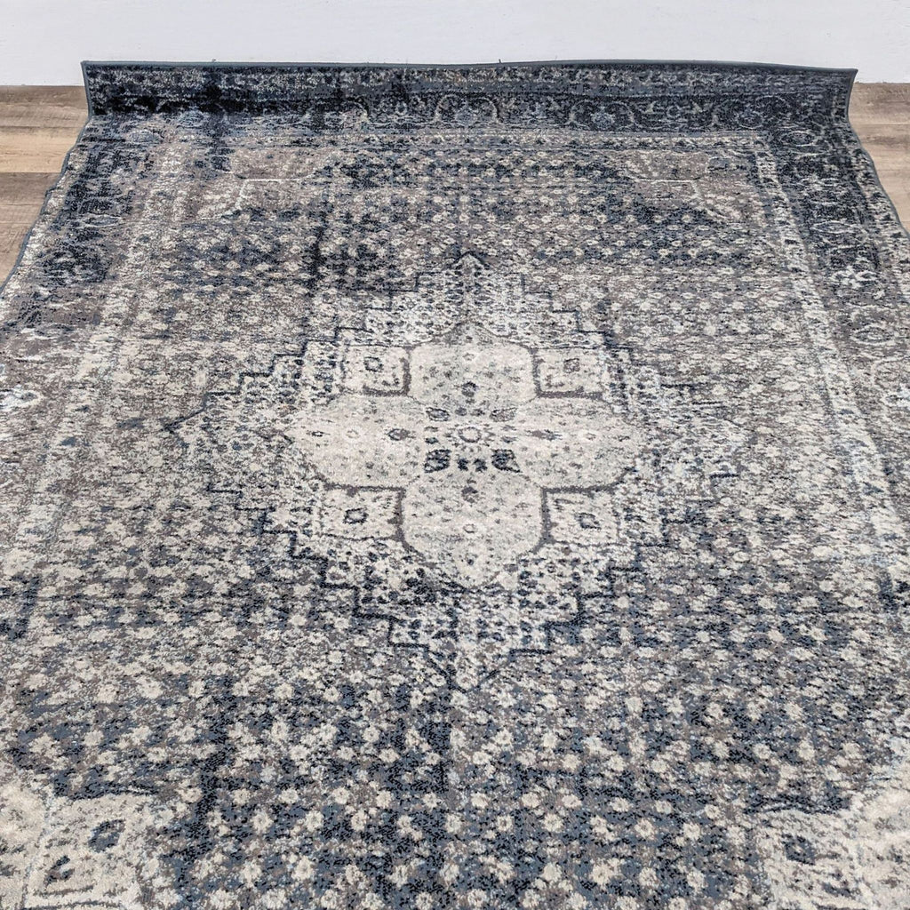 Close-up of the nuLOOM Kellum rug's intricate medallion and geometric patterns.