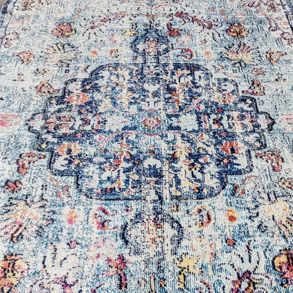 Close-up of a vintage-inspired medallion design on a rug.