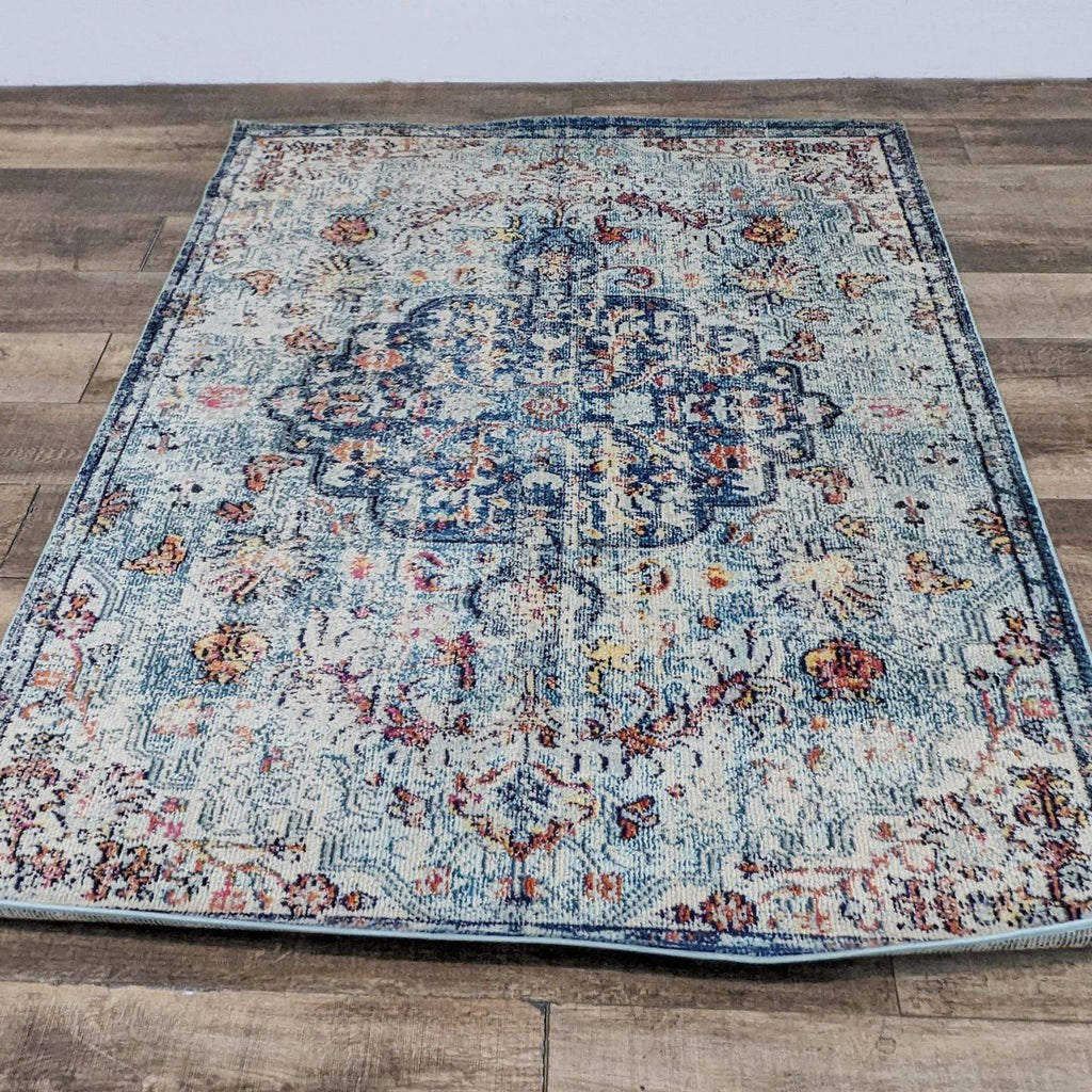Boho-style rug with a colorful, distressed medallion pattern.