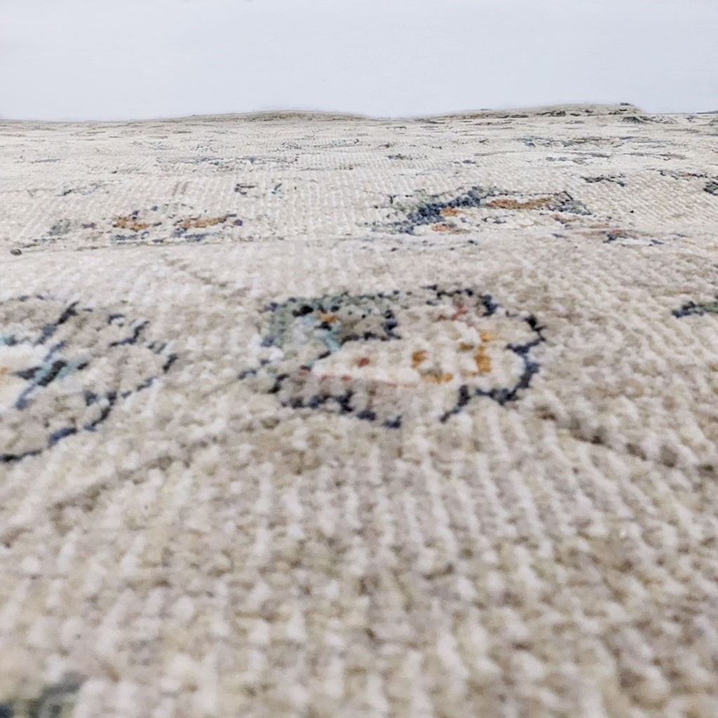 Close-up of the Evie rug texture highlighting the detailed weave and pattern in neutral colors.