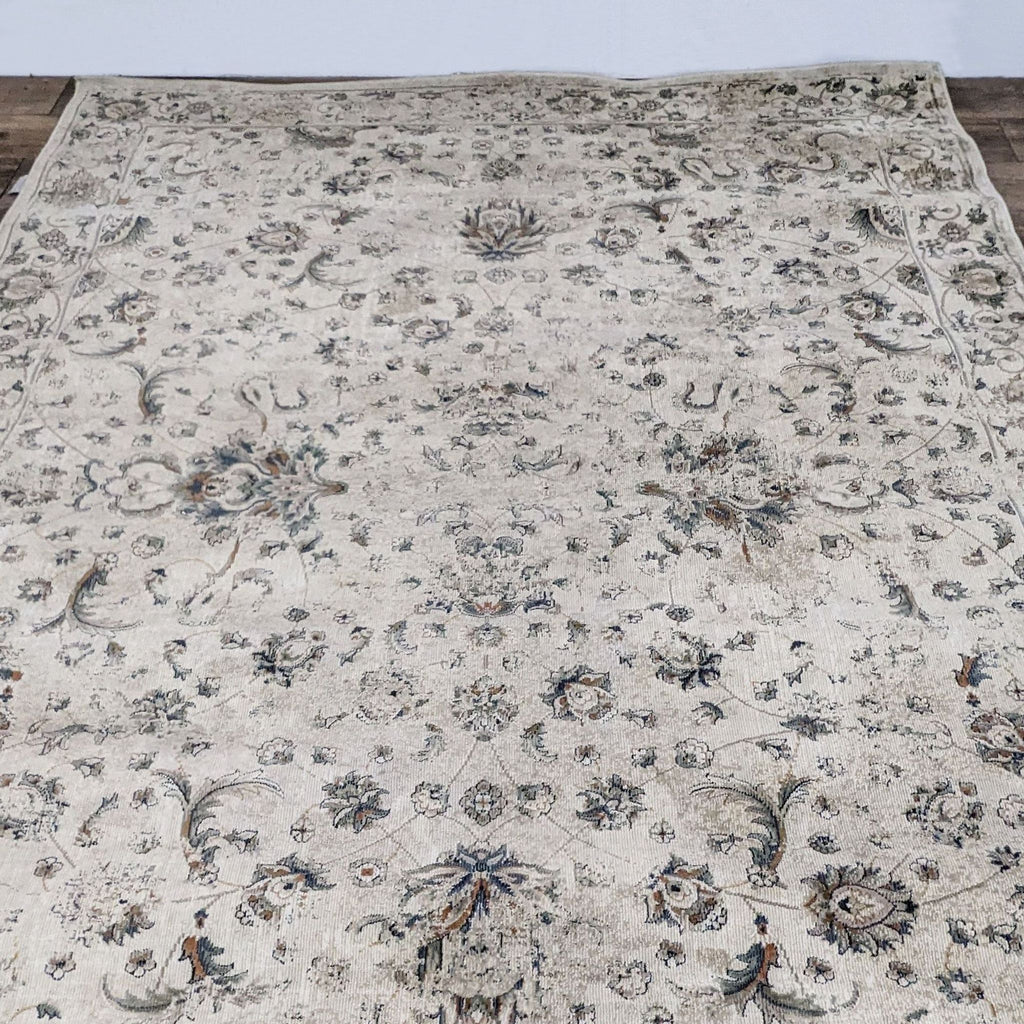 Evie rug from Magnolia Home in neutral tones, featuring intricate floral patterns.