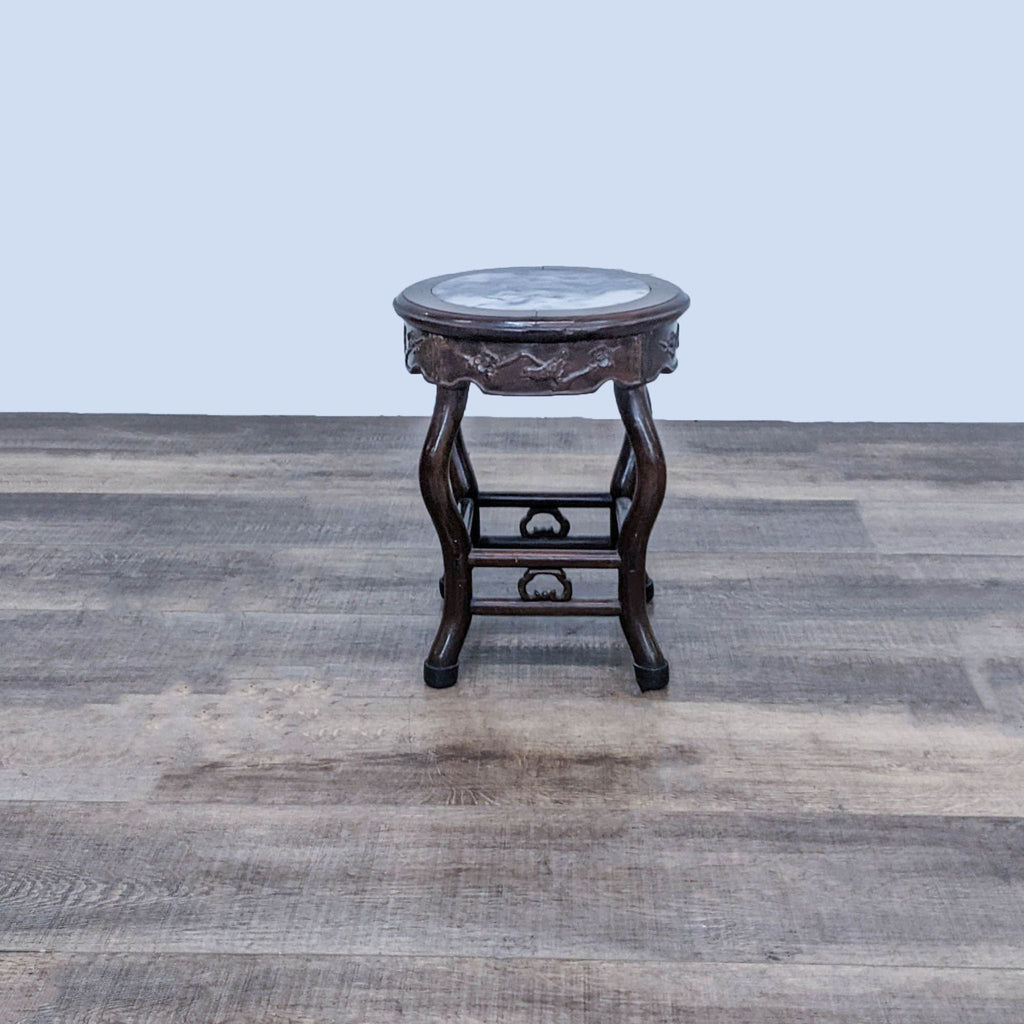 1. Reperch side table with curved wooden legs and a round marble top, displayed on a wooden floor.