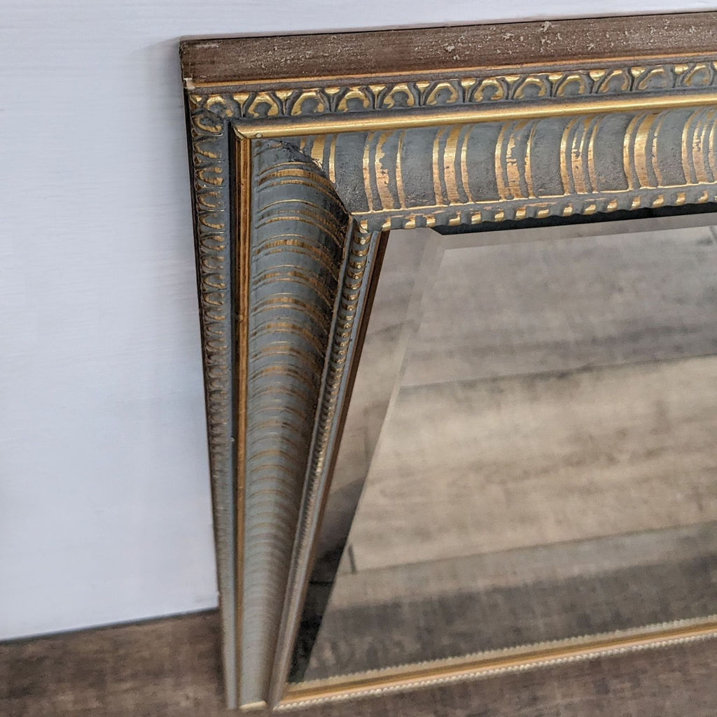 Close-up of a classic gold-framed mirror corner, Reperch.