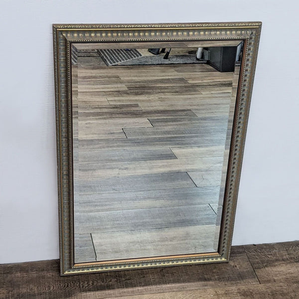Antique gold framed mirror with beveled design by Reperch.