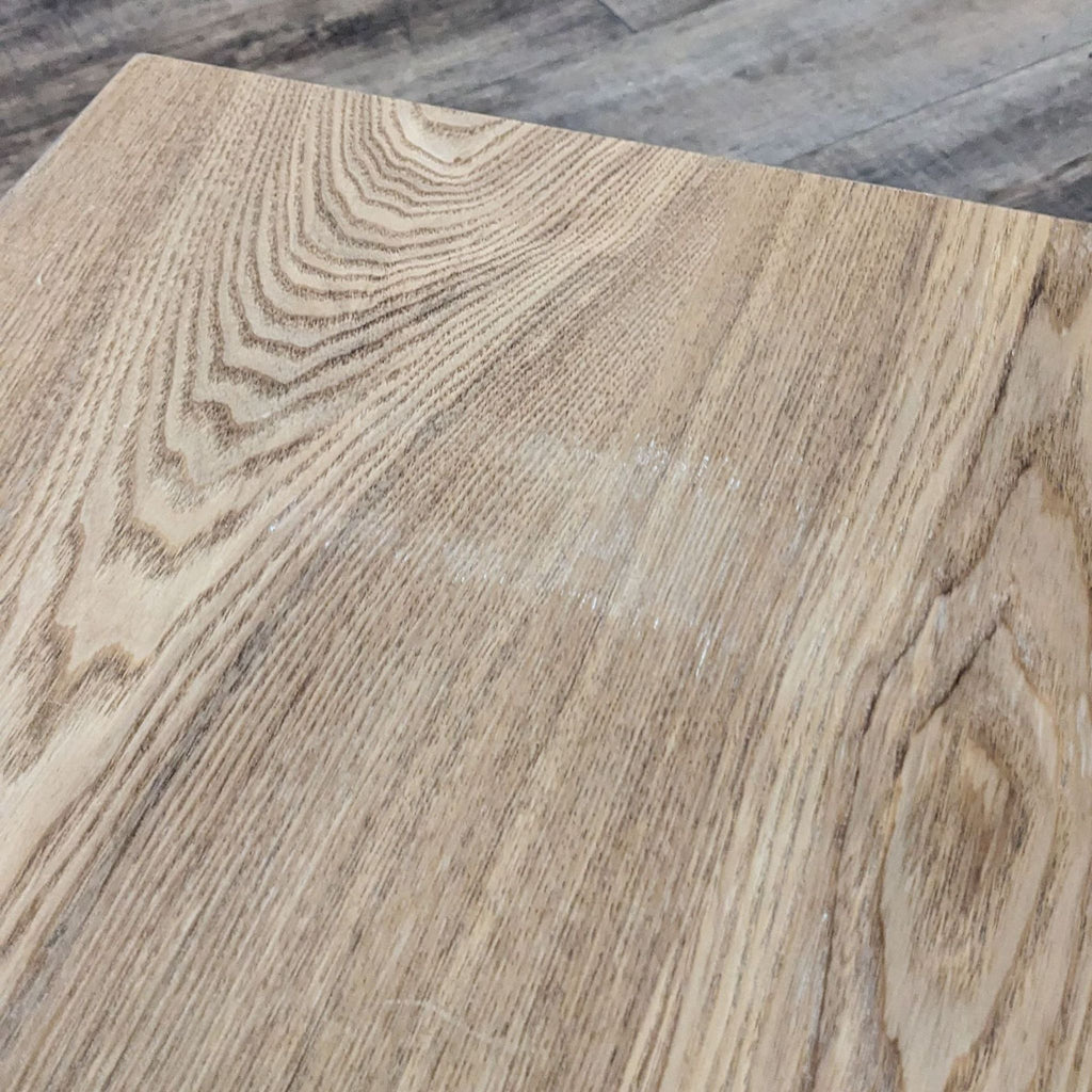 Close-up of wood grain texture on the Reperch Entertainment Center surface.