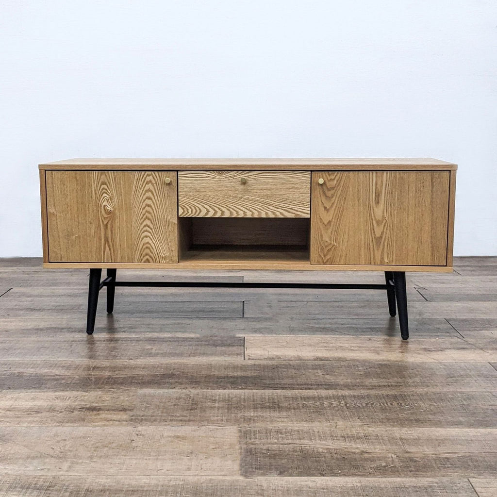 Reperch Entertainment Center with wood grain finish and black metal legs.