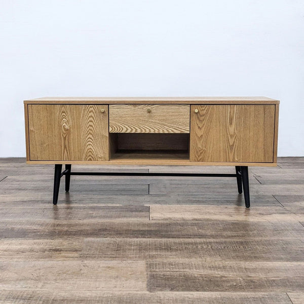 Reperch Entertainment Center with wood grain finish and black metal legs.