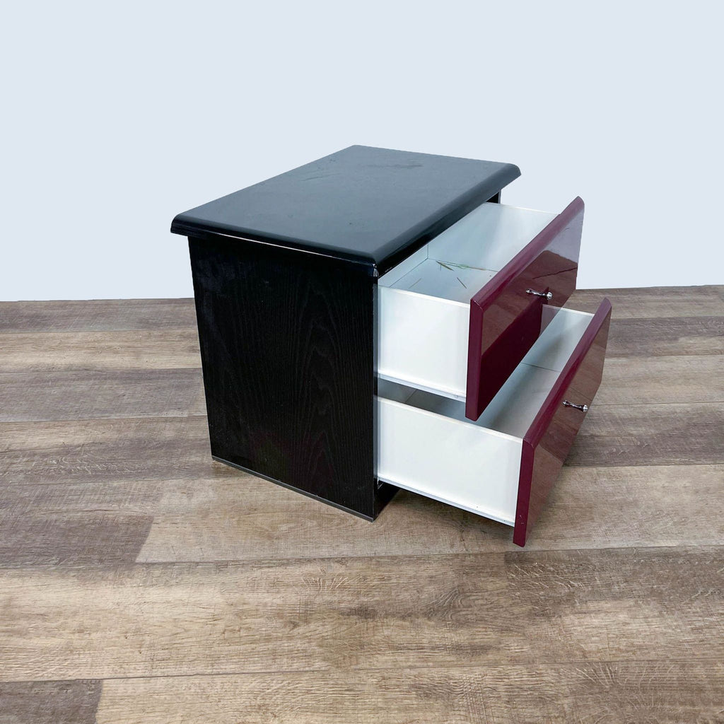 Side view of Millennium end table, displaying two open drawers on light wooden flooring.