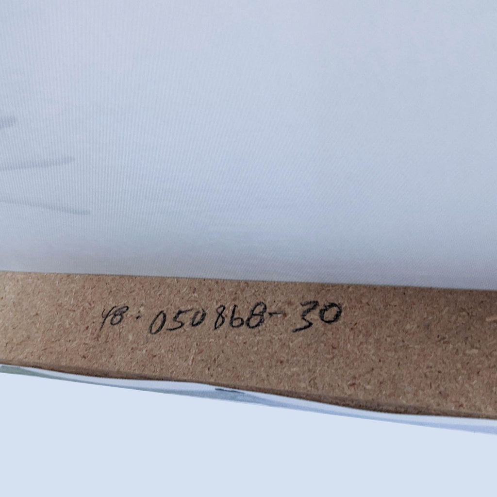 3. Close-up of handwritten serial number on the wooden frame of a Reperch giclee canvas print.