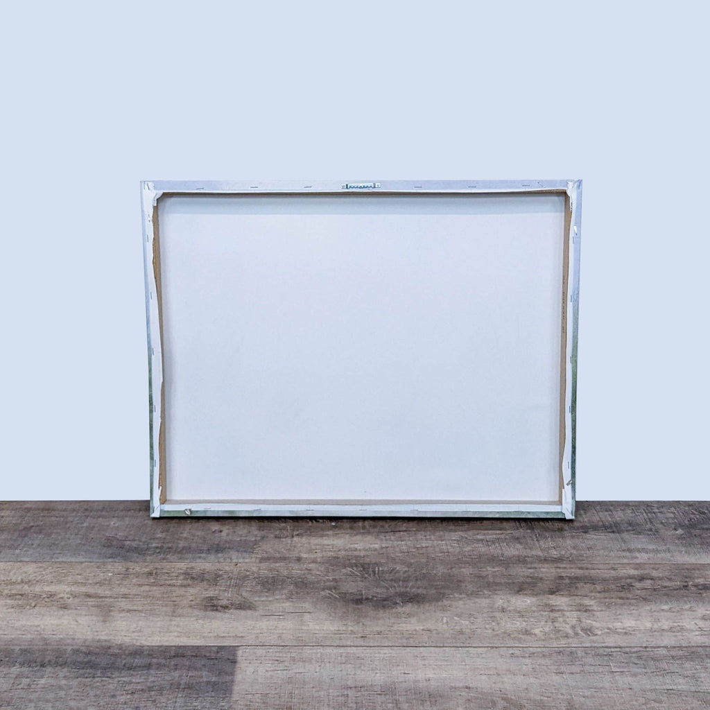 2. Back view of a Reperch giclee canvas print showing the plain, stretched canvas and frame.  