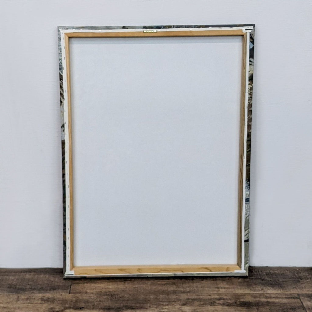 Back view of framed abstract canvas by Alexis Bueno, showcasing wood frame.