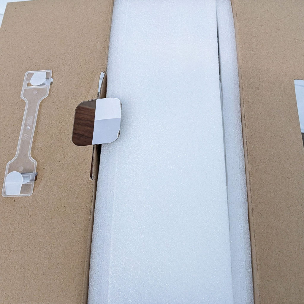 Close-up of Vankyo projector packaging, showing secured white foam interior.