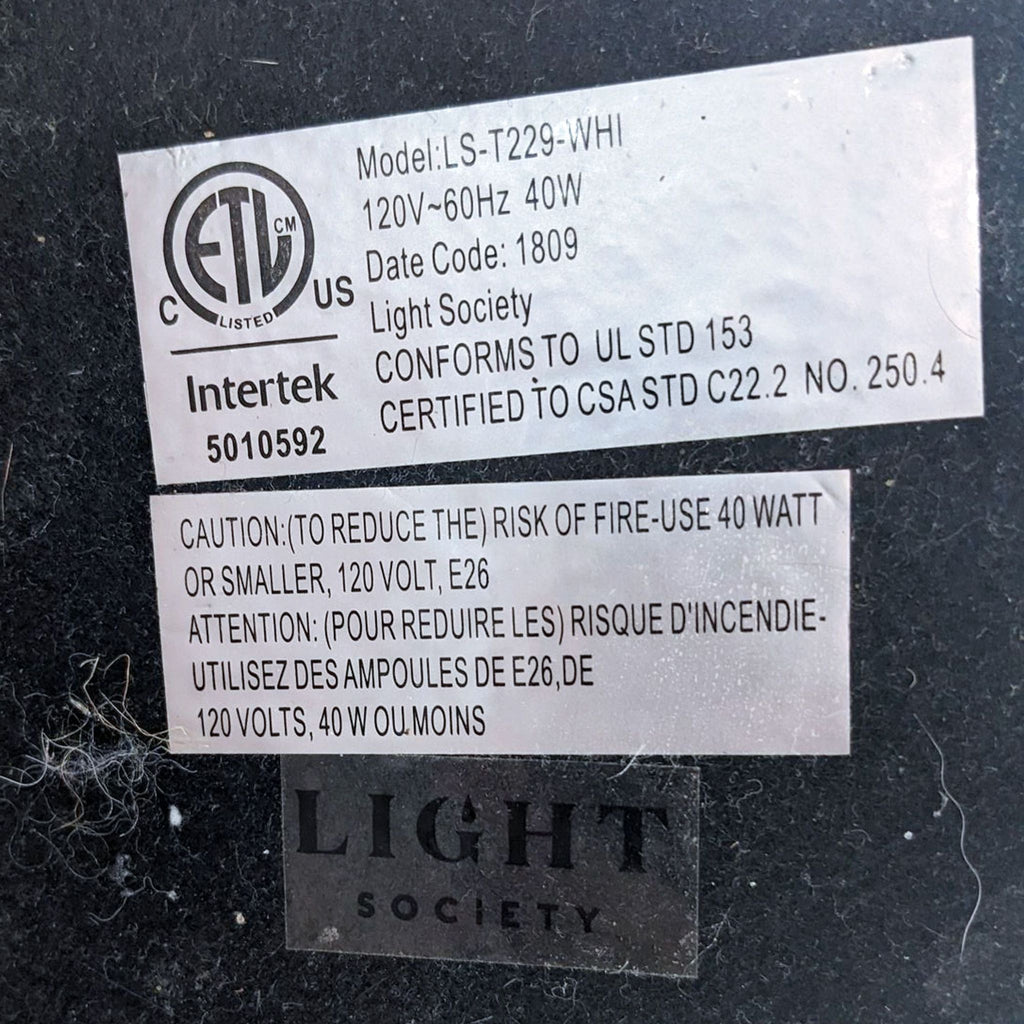 Label with electrical specifications and brand information.