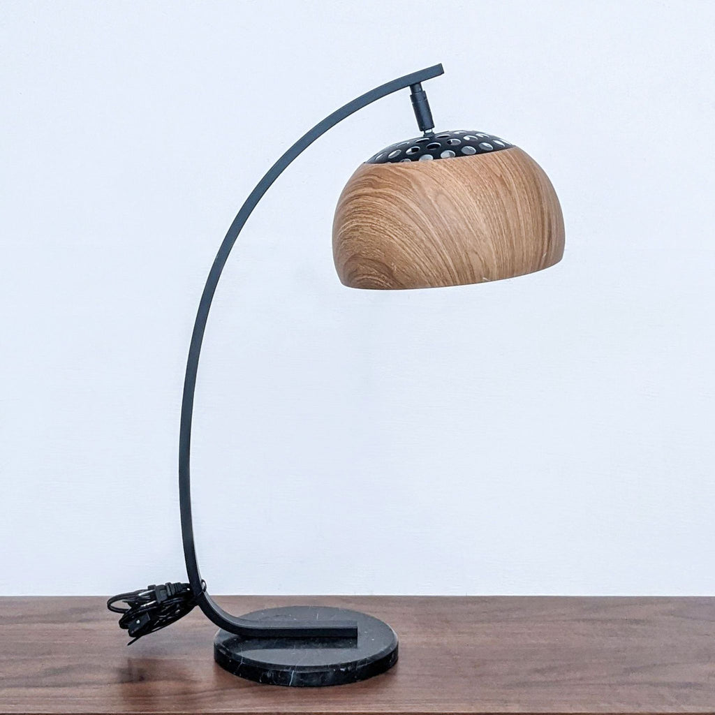 Zou Modern's stylish lamp with black metal frame and wood-textured shade.