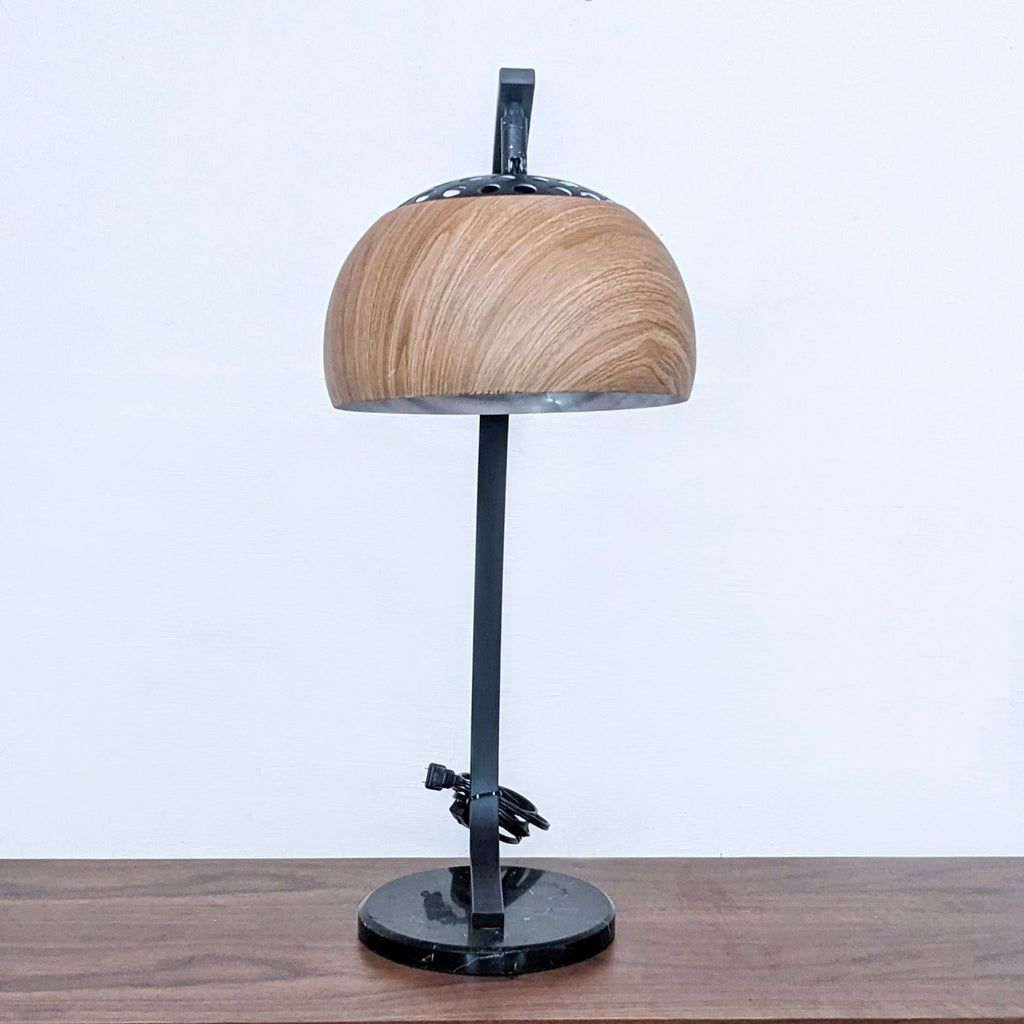 Modern lamp with round wooden shade and black marble base, from Zou Modern.