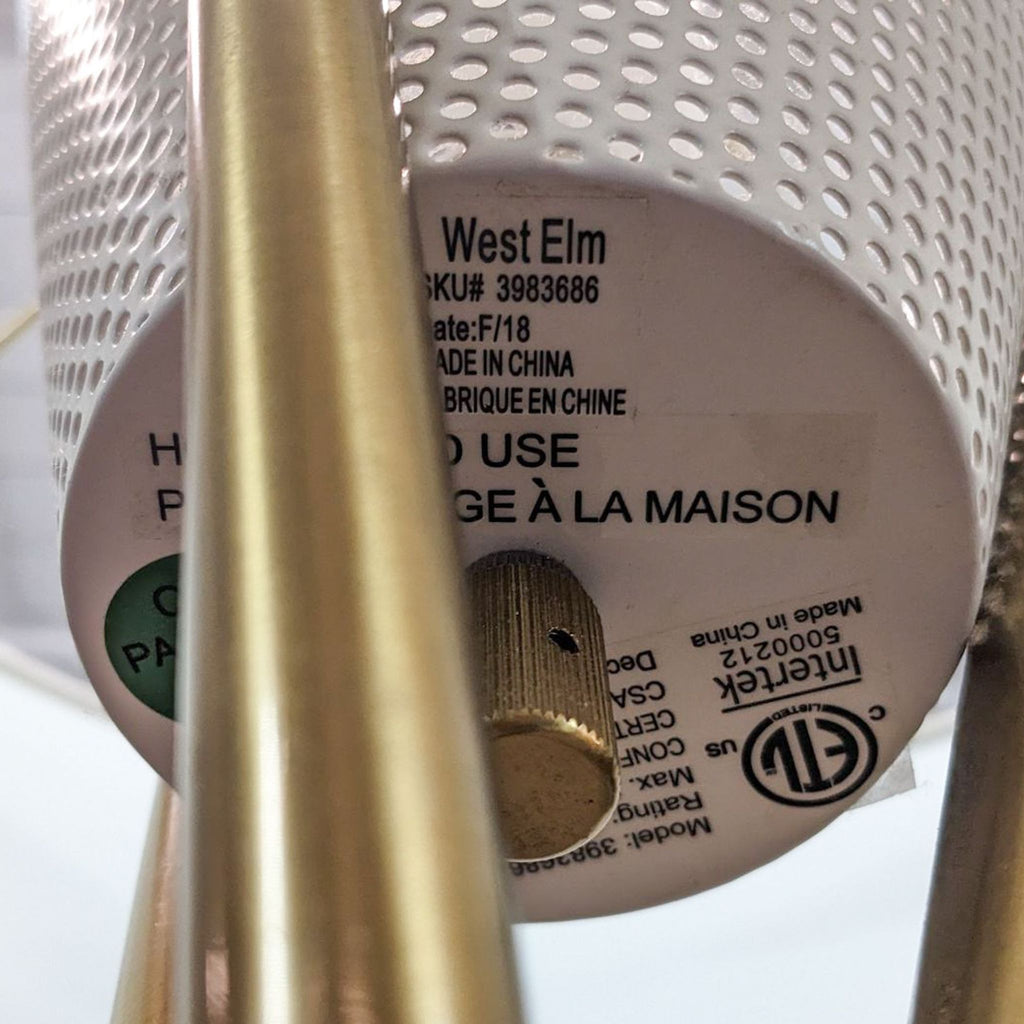 Label on lamp indicating brand West Elm and product details.