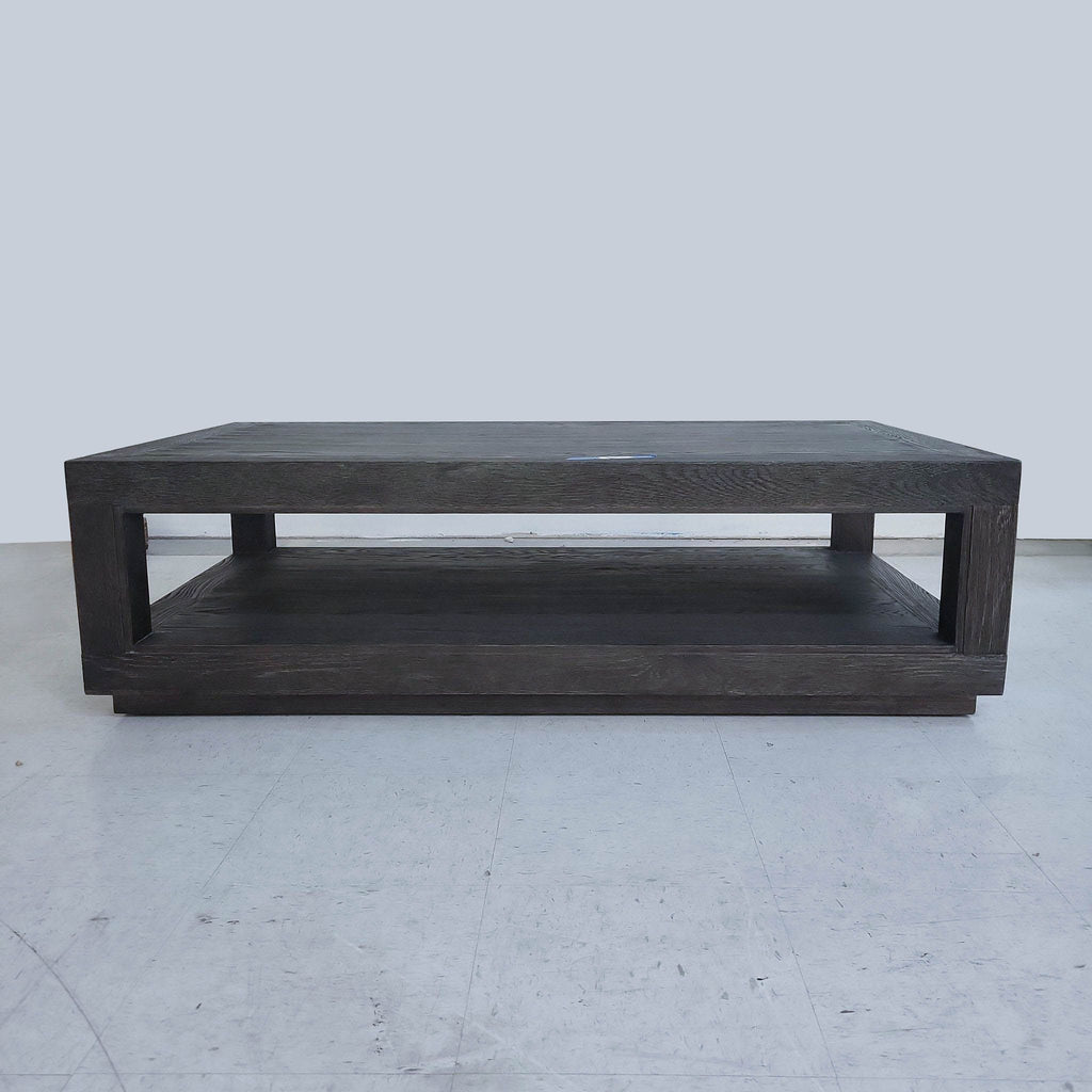 Rectangular dark wood coffee table with a lower shelf, by Restoration Hardware.