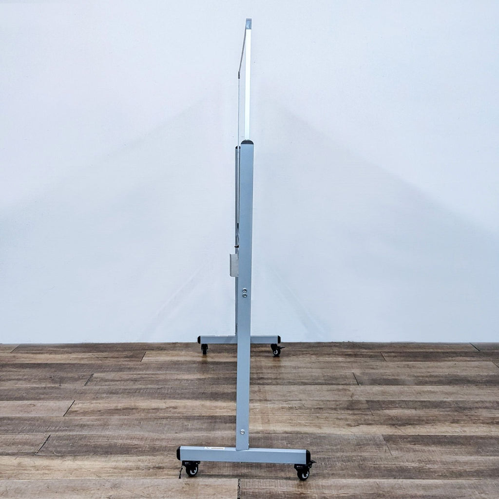 Slim mobile whiteboard design with sturdy gray frame and casters.