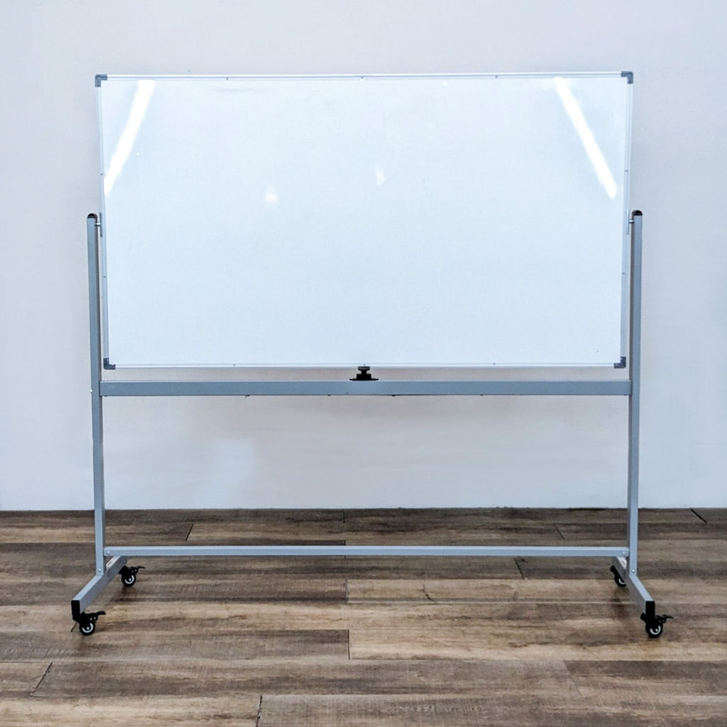 Large whiteboard on gray frame with wheels, suitable for offices and classrooms.