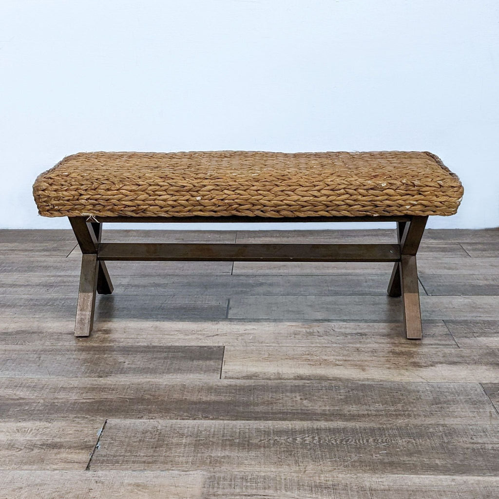 Handcrafted Reperch bench, woven top on sturdy criss-cross wood frame.