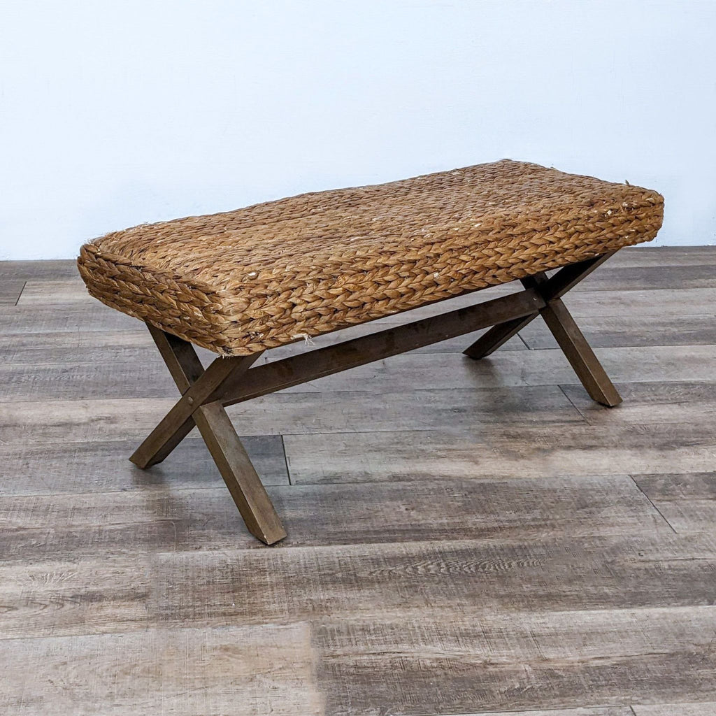 Reperch bench featuring a woven reed top and solid wooden frame.
