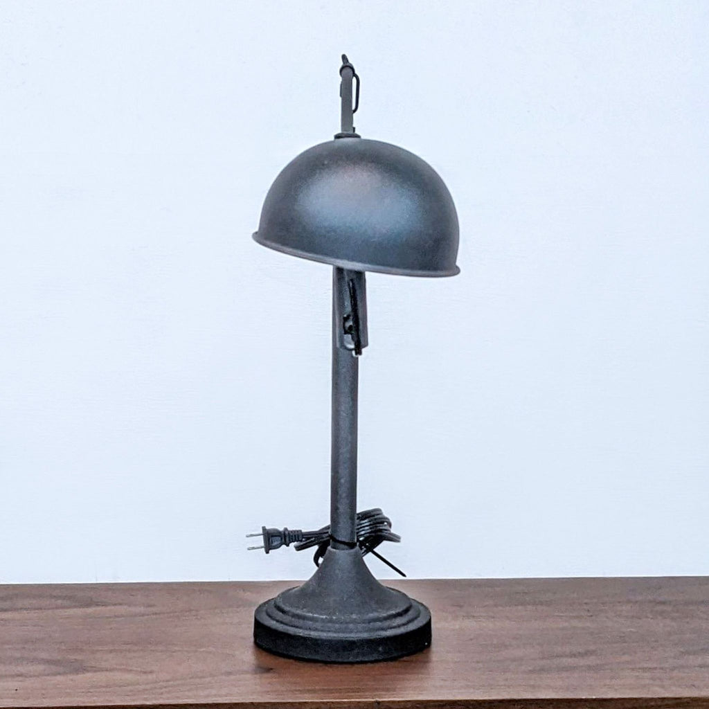 Vintage-style Reperch lamp with a dome shade and sturdy base.
