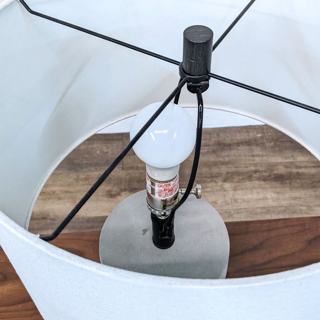 Top view of Reperch lamp showing bulb and internal lamp frame structure.