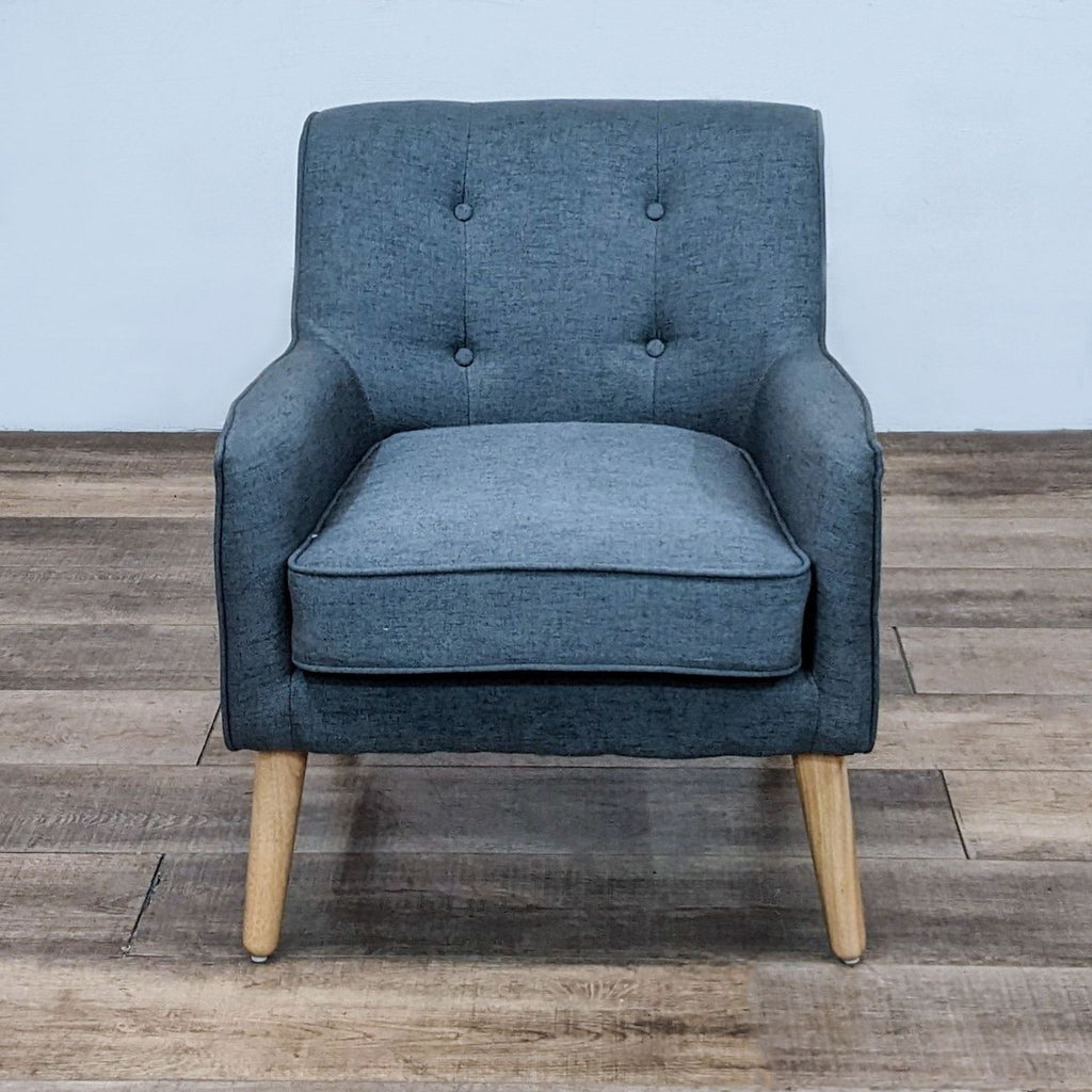 Mid-century armchair with tufted back and wooden legs by Noble House. Extra padded for comfort.