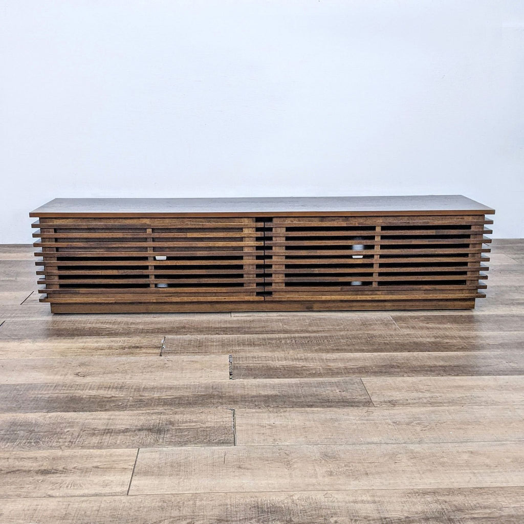 Scandinavian-style walnut TV stand with slim fir wood strips and front door.
