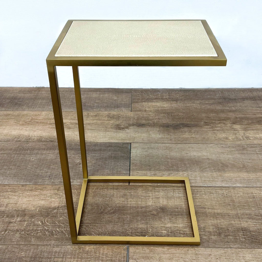 Shagreen-embossed leather tabletop with brass-finish steel frame. End table by Restoration Hardware.