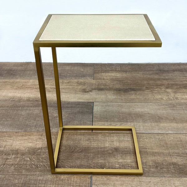 Shagreen-embossed leather tabletop with brass-finish steel frame. End table by Restoration Hardware.