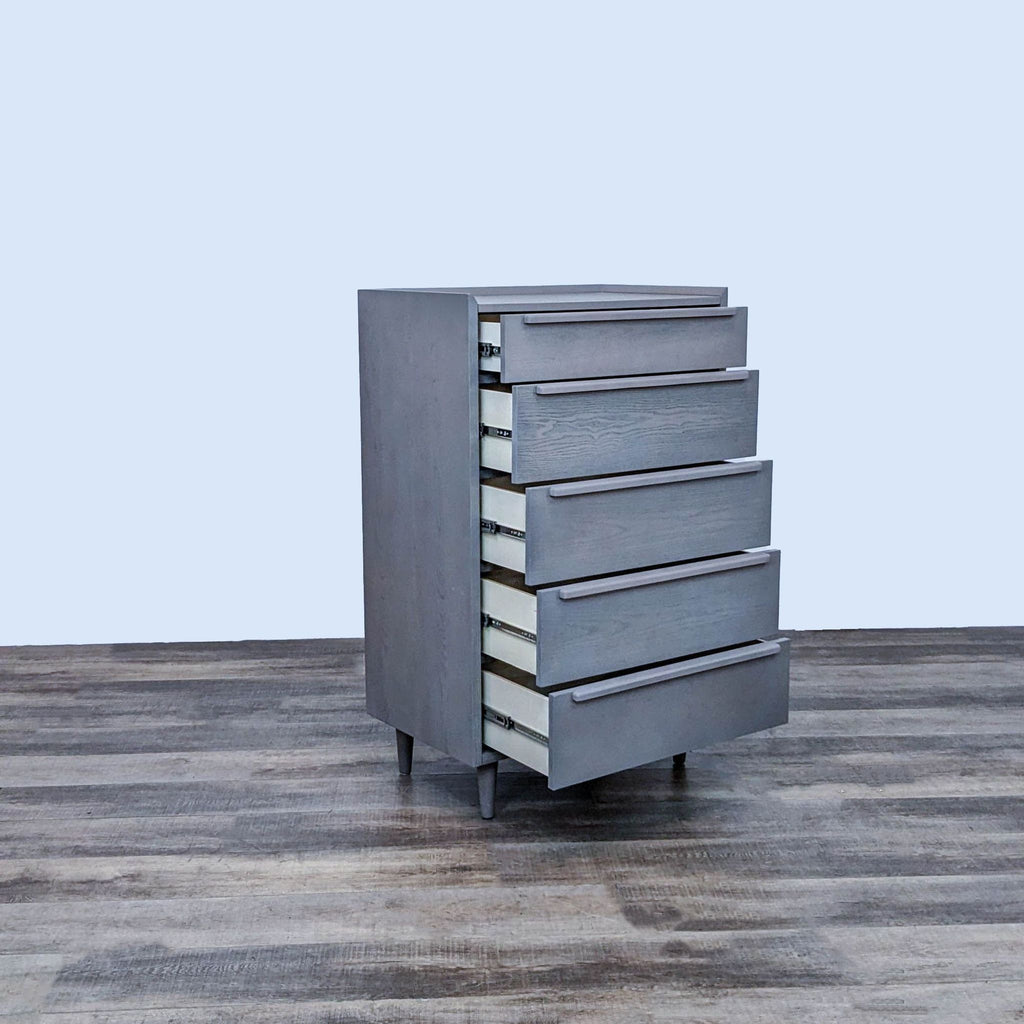 Open drawers of Crate & Barrel chest, showing streamlined shapes and undercut pulls.
