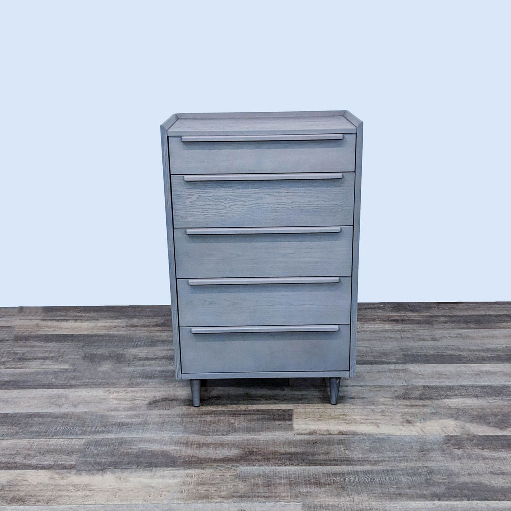 Crate & Barrel chest with five drawers in light stone finish, mid-century design.