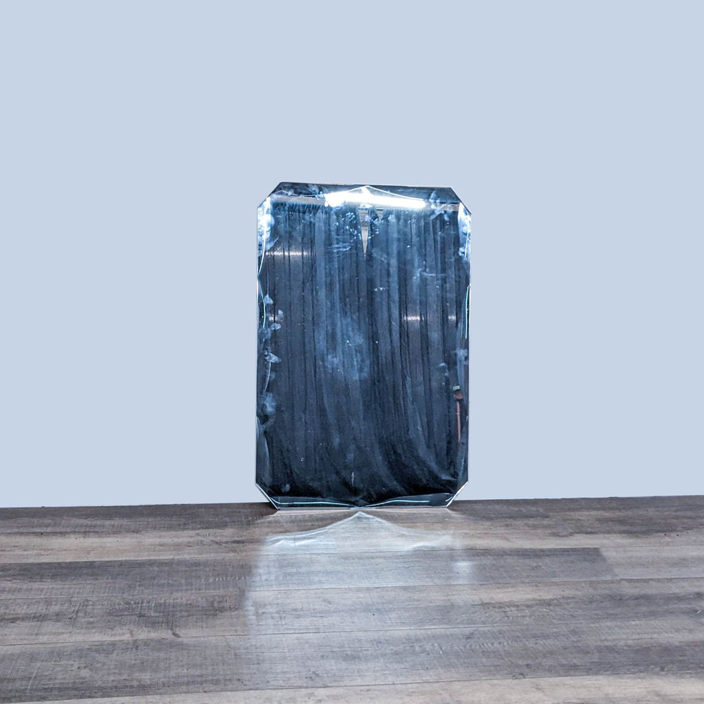 Rectangular mirror with angled corners and thin metal frame by Crate & Barrel.
