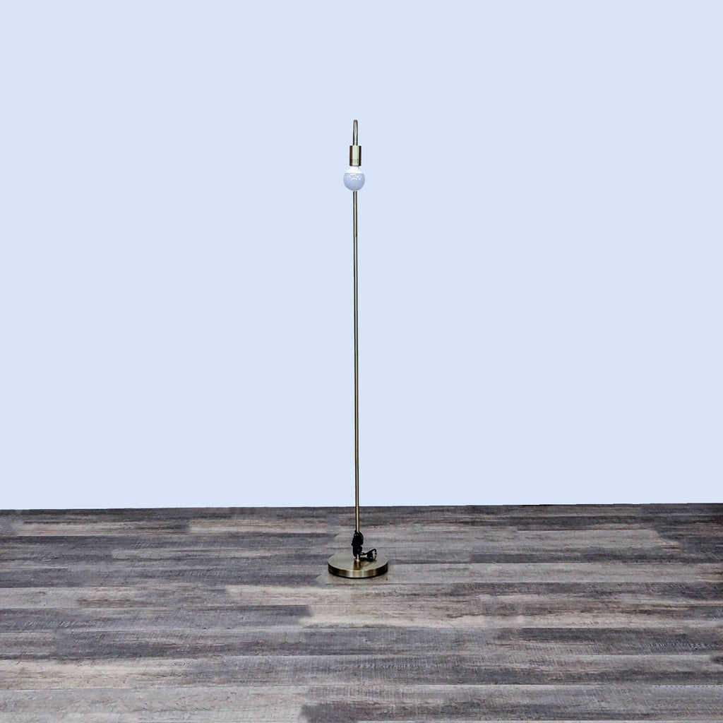 3. Reperch brand floor lamp featuring a slim metallic body and round base, shown in a spacious room setting.