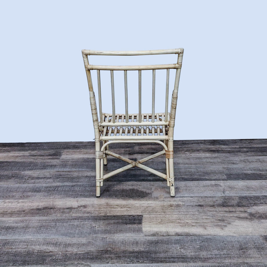 Elegant rattan Pottery Barn chair, ideal for enhancing any room's decor.