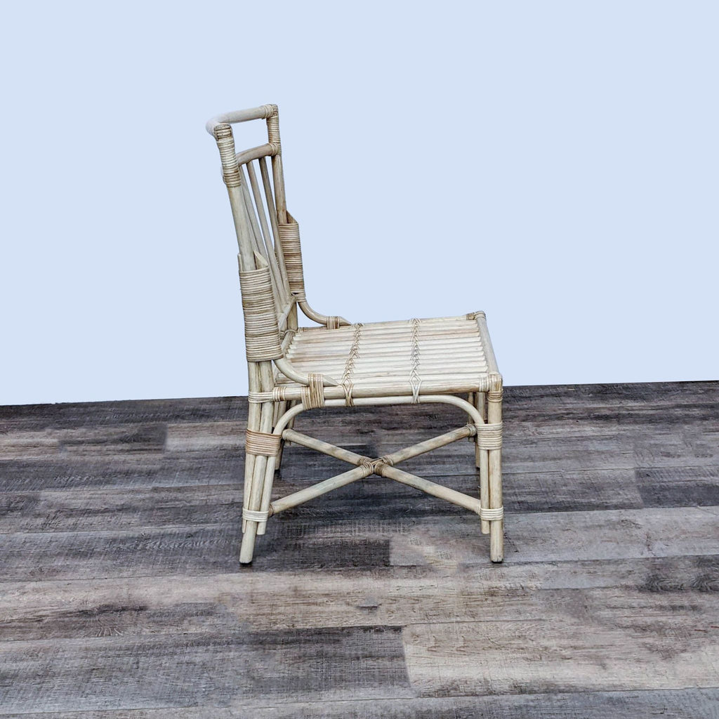 Rattan dining chair by Pottery Barn, featuring a warm and airy profile.