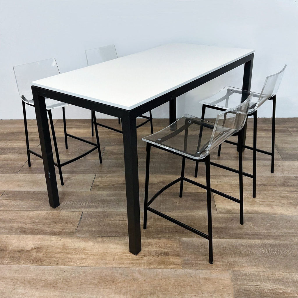 Dining set with four Chiaro stools by CB2, featuring clear acrylic seats and black steel legs.